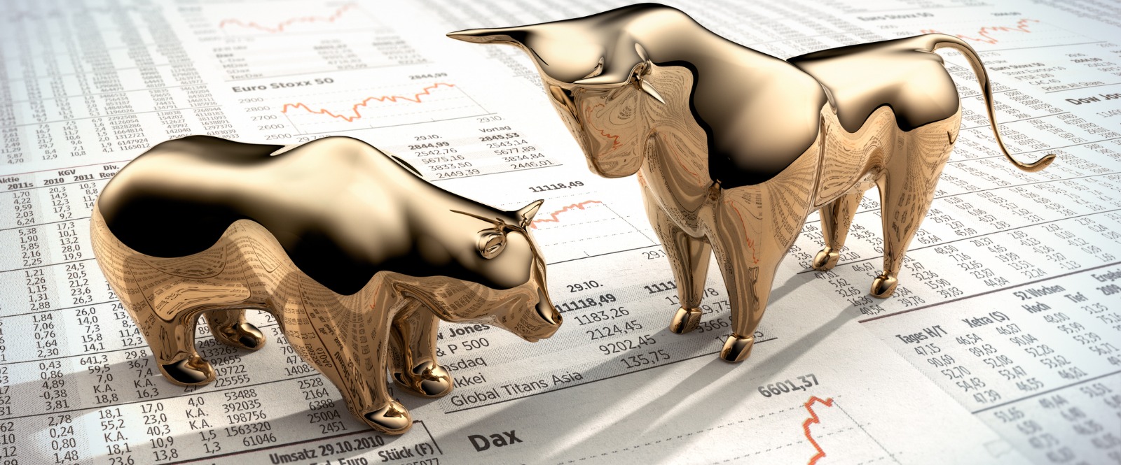 Brass bear and Brass Bull statues standing on the stock market reports