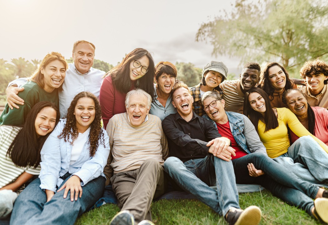 A happy group of generations of men and women